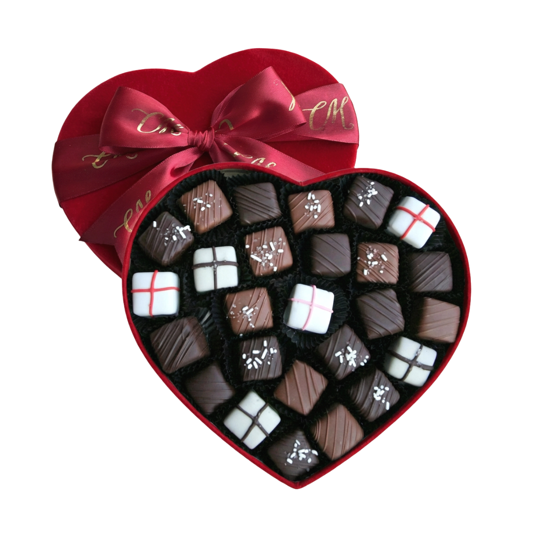 Surtido de caramelos de chocolate en caja con forma de corazón